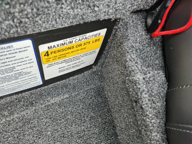 Slide: The Image of 2019 Tracker Pro Team 190 TX capacity label, 4 persons or 575 lbs limit. - 12