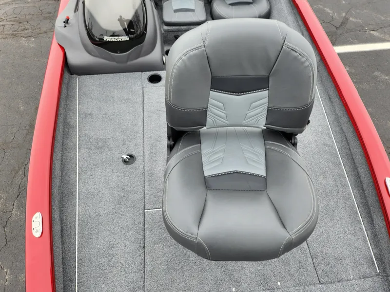 Slide: The Image of 2019 Tracker Pro Team 190 TX Tournament Edition boat with gray seating and red trim. - 16