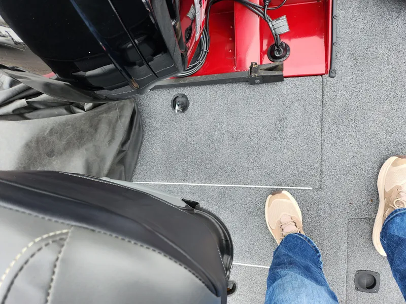 Slide: The Image of 2019 Tracker Pro Team 190 TX Tournament Edition boat interior with carpeted floor and seat. - 20