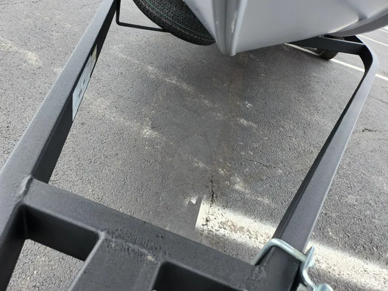 Slide: The Image of 2019 Tracker Pro Team 190 TX boat trailer on asphalt. - 8