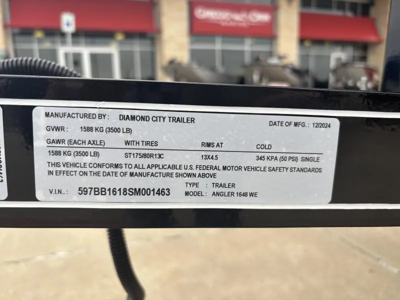 Slide: The Image of Label on a Diamond City Trailer, showing specifications and compliance details. - 12