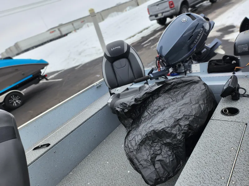 Slide: The Image of 2019 Lund 1600 Fury Tiller boat with Yamaha outboard motor in snowy setting. - 16
