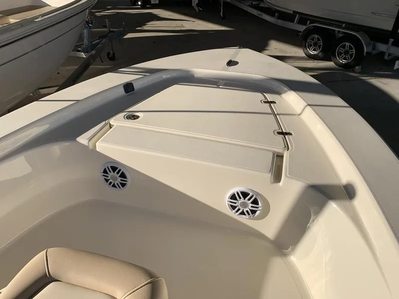 Slide: The Image of 2025 Scout 177 Sport boat interior with seating and storage compartment. - 10