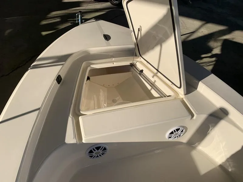 Slide: The Image of 2025 Scout 177 Sport boat interior with storage compartment and speakers. - 11