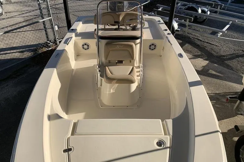 Slide: The Image of 2025 Scout 177 Sport boat interior with seating and steering console. - 14