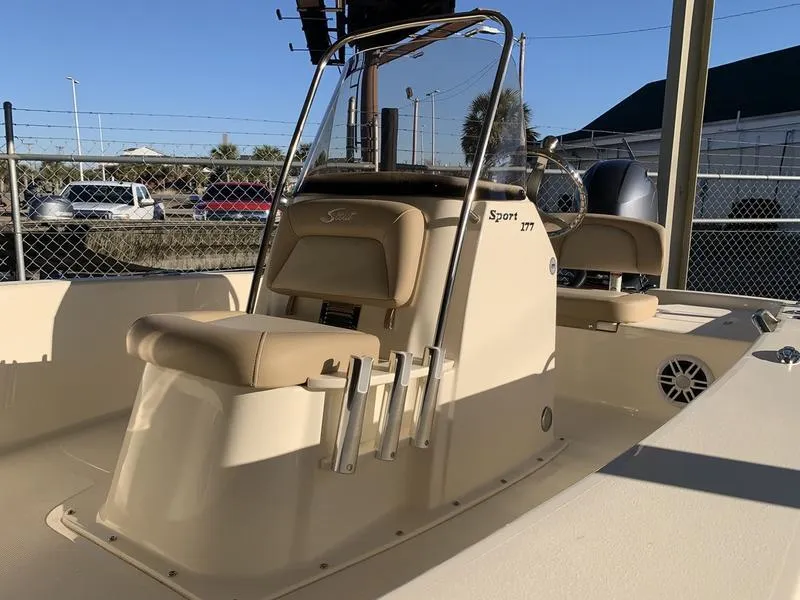 Slide: The Image of 2025 Scout 177 Sport boat dashboard with steering wheel and control panel. - 7