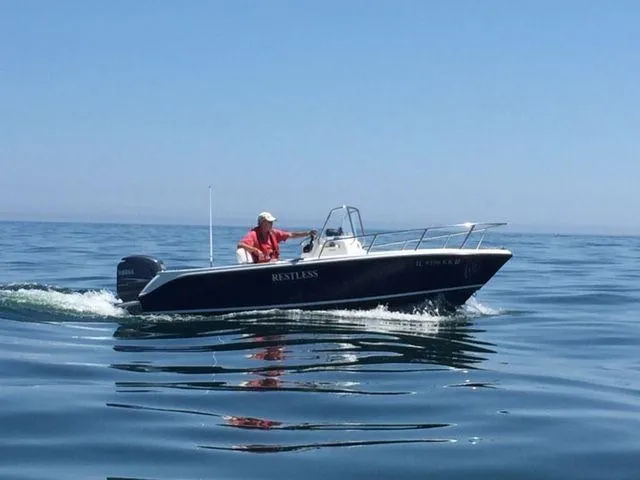 Slide: The Image of 2011 Edgewater 170CC boat cruising on calm ocean waters. - 19