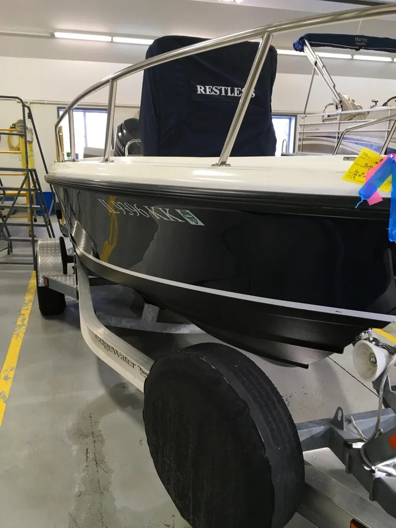 Slide: The Image of 2011 Edgewater 170CC boat on trailer in indoor storage facility. - 4