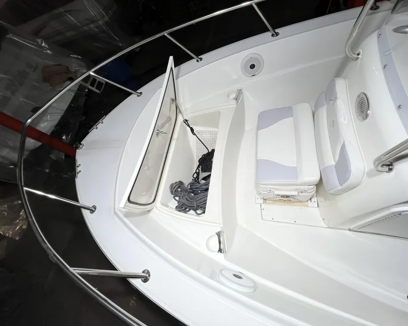 Slide: The Image of Edgewater 170CC 2011 boat interior with open storage compartment and seating. - 7