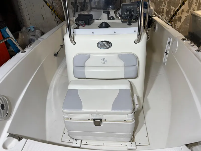 Slide: The Image of 2011 Edgewater 170CC boat interior with seating and console. - 8