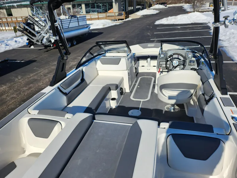 Slide: The Image of 2019 Heyday WT-2DC boat interior with seating and steering wheel, parked on snowy pavement. - 10