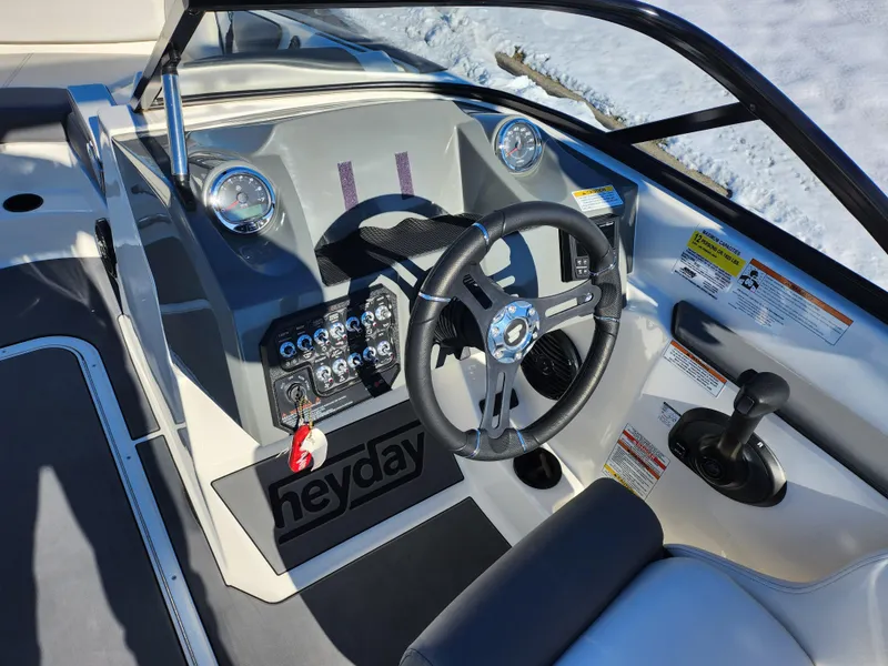 Slide: The Image of 2019 Heyday WT-2DC boat dashboard with steering wheel and control panel. - 13