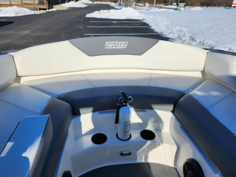 Slide: The Image of 2019 Heyday WT-2DC boat interior with seating and a fire extinguisher. - 17
