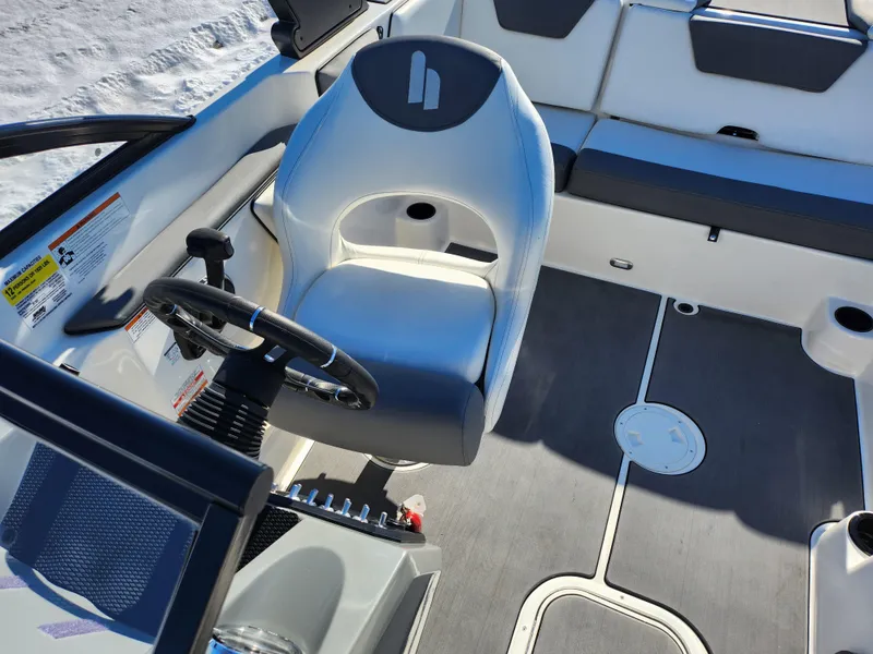Slide: The Image of 2019 Heyday WT-2DC boat interior with steering wheel and seating. - 20