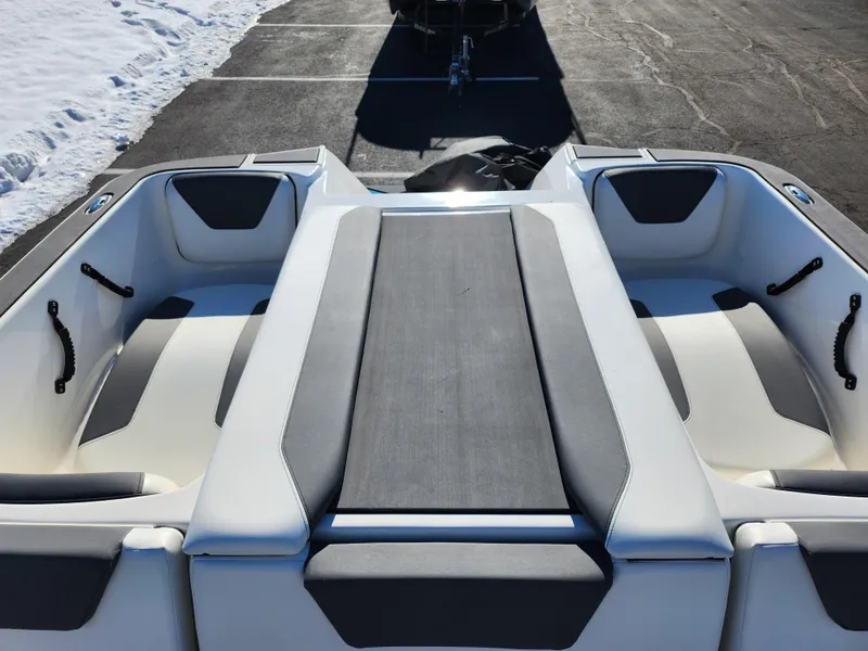 Slide: The Image of 2019 Heyday WT-2DC boat interior with gray and white seating in a snowy parking lot. - 22