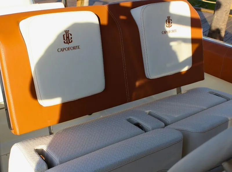 Slide: The Image of Luxurious seating on 2024 Capoforte FX270 boat with elegant brown and white upholstery. - 12