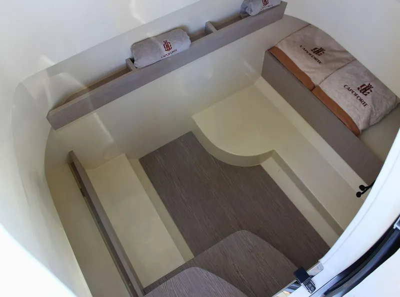 Slide: The Image of 2024 Capoforte FX270 cabin interior with cushions and bedding, showcasing modern design and comfort. - 13