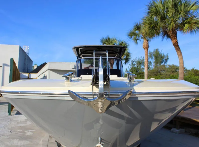 Slide: The Image of 2024 Capoforte FX270 boat with anchor, docked under clear blue sky. - 7