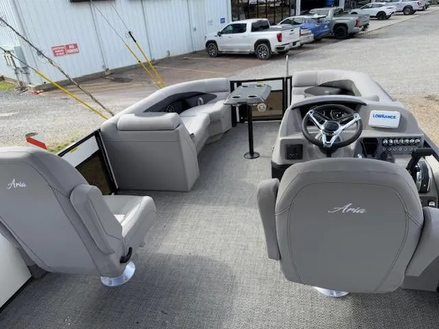 Slide: The Image of 2025 Barletta ARIA 22UC pontoon boat interior with gray seating and steering console. - 11