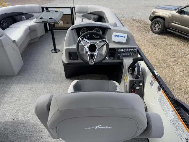 Slide: The Image of 2025 Barletta ARIA 22UC boat interior with steering wheel and seating. - 12