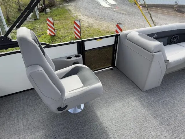 Slide: The Image of 2025 Barletta ARIA 22UC boat interior with gray seating and cup holders. - 13