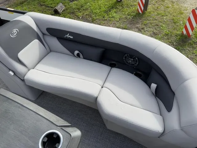 Slide: The Image of 2025 Barletta ARIA 22UC boat interior with gray seating and cup holders. - 16