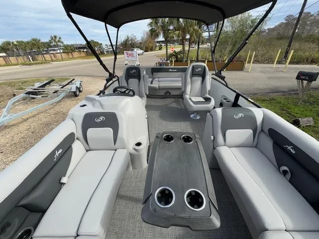 Slide: The Image of 2025 Barletta ARIA 22UC pontoon boat interior with gray seating and table. - 17