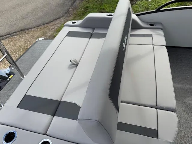 Slide: The Image of 2025 Barletta ARIA 22UC boat seating with gray upholstery and cup holders. - 9