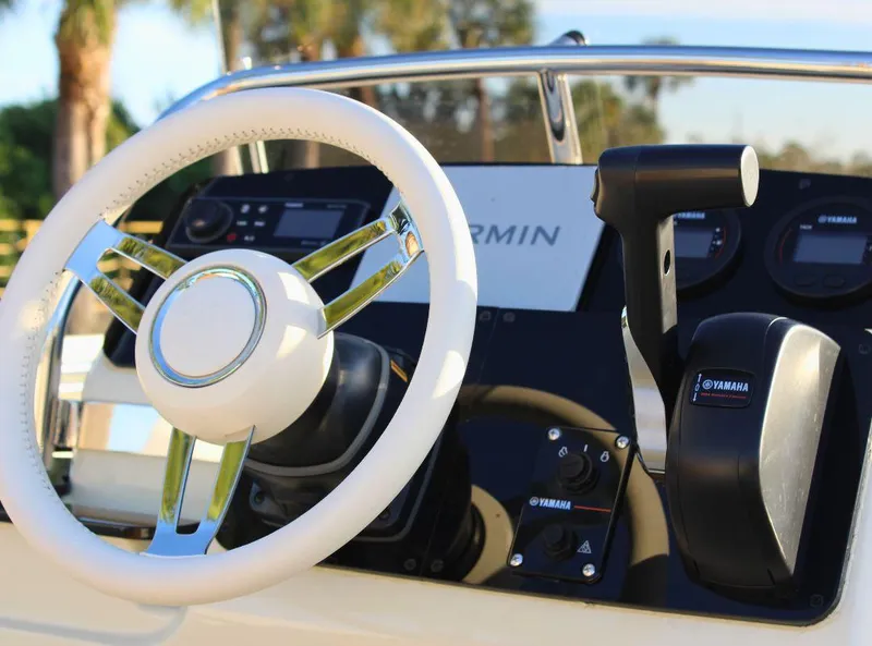Slide: The Image of 2024 Capoforte SX200 boat dashboard with steering wheel and controls. - 12