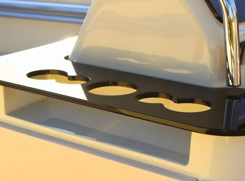 Slide: The Image of 2024 Capoforte SX200 boat detail with sleek black cup holders. - 14