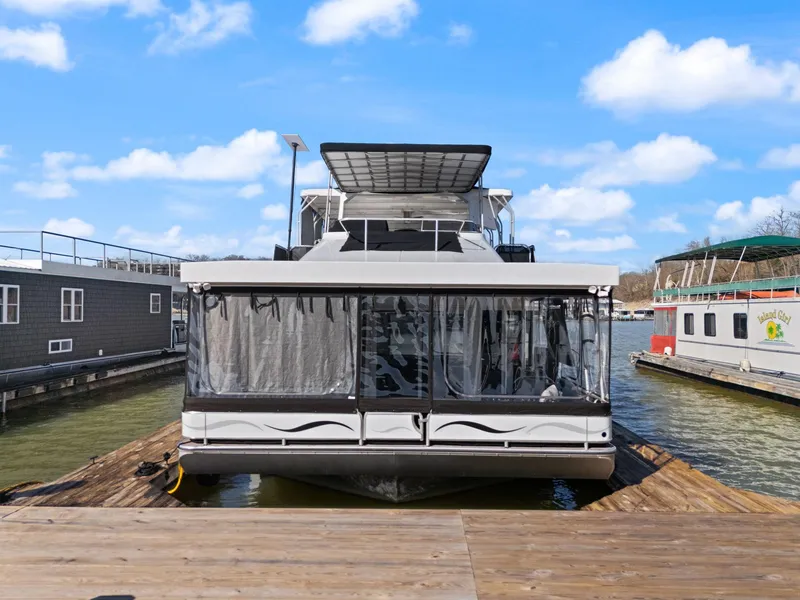 Slide: The Image of 2011 Horizon 18 X 82 houseboat docked on a sunny day. - 1