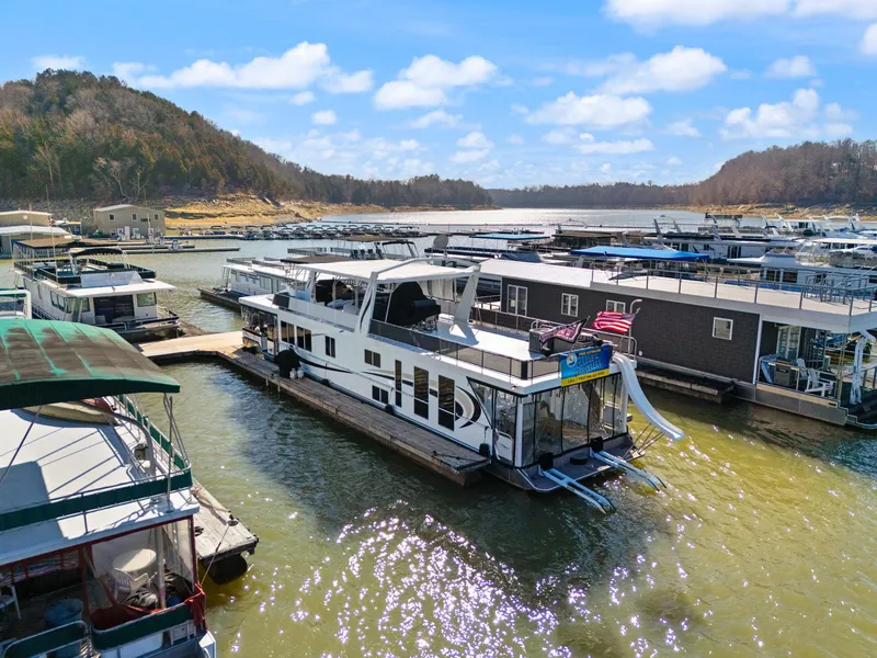 Slide: The Image of 2011 Horizon 18 X 82 houseboat docked at a marina on a sunny day. - 12