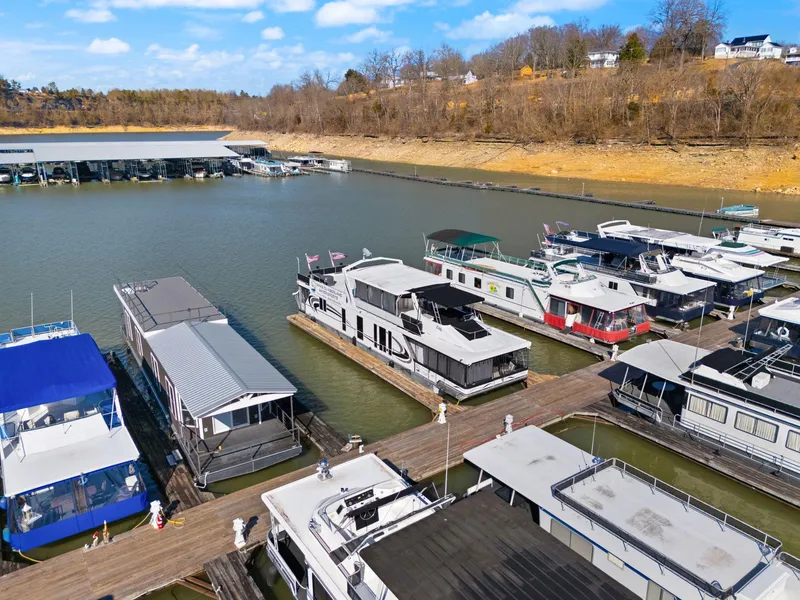 Slide: The Image of Houseboats docked at marina, featuring 2011 Horizon 18 X 82 model. - 13