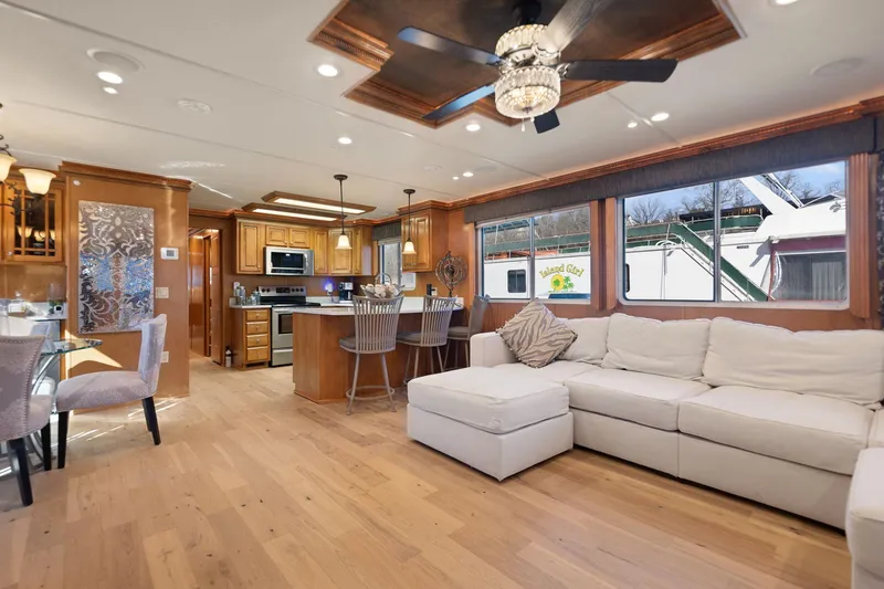 Slide: The Image of Luxurious interior of 2011 Horizon 18 X 82 houseboat with modern kitchen and cozy living area. - 18