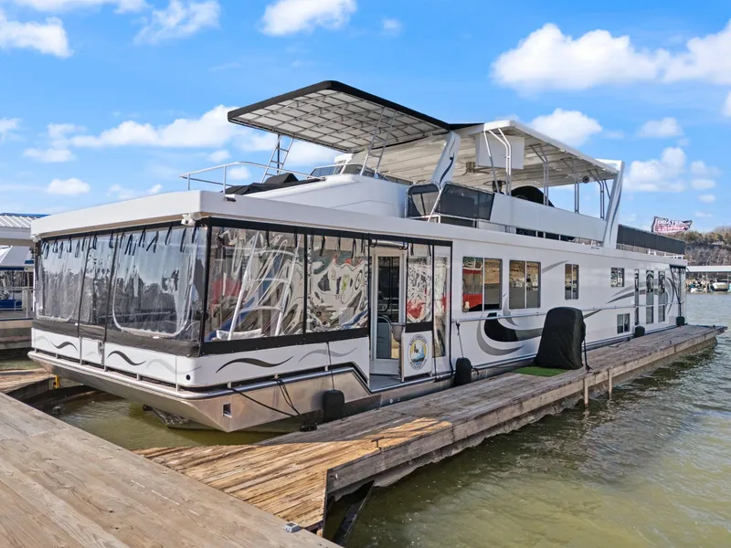 Slide: The Image of 2011 Horizon 18 X 82 houseboat docked on a sunny day. - 2