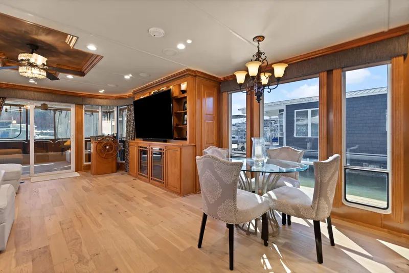 Slide: The Image of Luxurious interior of 2011 Horizon 18 X 82 houseboat with elegant dining area and entertainment center. - 25