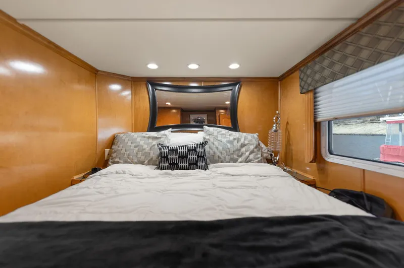 Slide: The Image of Luxurious bedroom in 2011 Horizon 18 X 82 houseboat with modern decor and window view. - 27