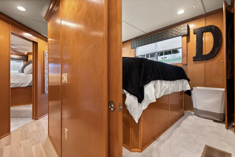 Slide: The Image of Interior of 2011 Horizon 18 X 82 Houseboat with wood paneling and cozy bedroom. - 28