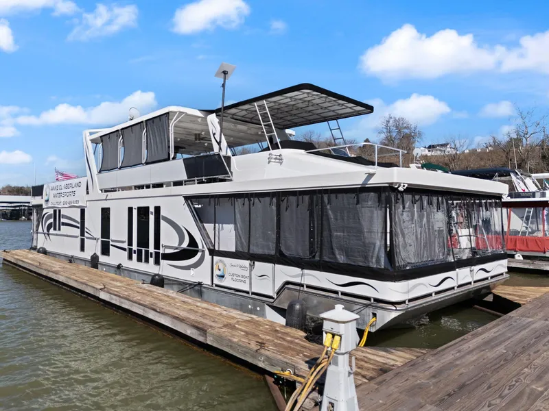 Slide: The Image of 2011 Horizon 18 X 82 houseboat docked on a sunny day. - 3