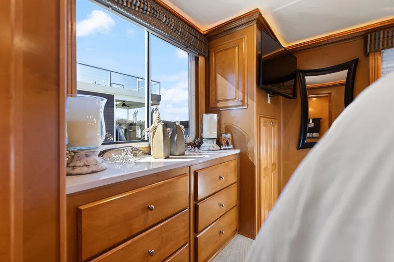 Slide: The Image of Luxurious interior of 2011 Horizon 18 X 82 houseboat with wooden cabinetry and decorative items. - 34