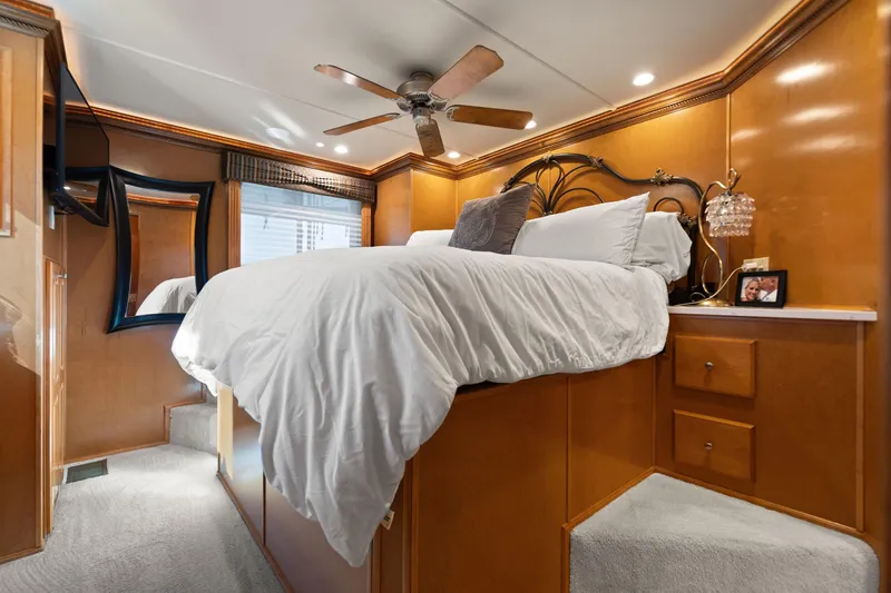 Slide: The Image of Luxurious bedroom interior of 2011 Horizon 18 X 82 houseboat with elevated bed and elegant decor. - 36