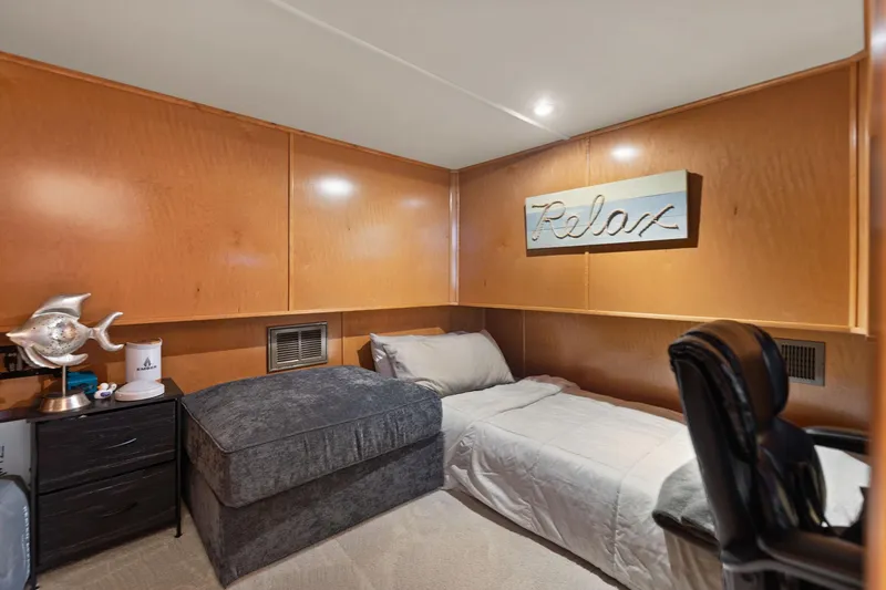 Slide: The Image of Cozy bedroom in 2011 Horizon 18 X 82 houseboat with wooden walls and "Relax" sign. - 42
