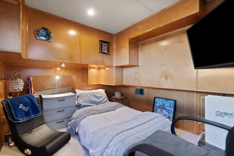 Slide: The Image of Cozy bedroom in 2011 Horizon 18 X 82 houseboat with modern furnishings and wood paneling. - 43
