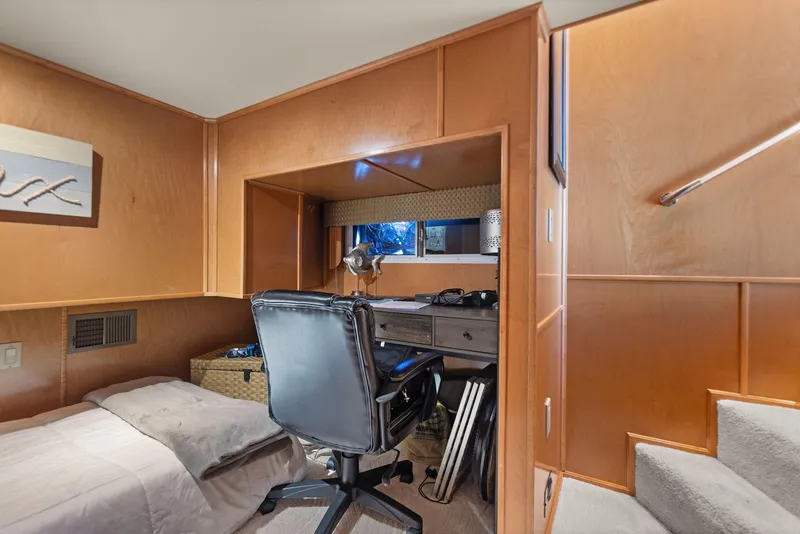 Slide: The Image of Interior of 2011 Horizon 18 X 82 Houseboat with desk, chair, and bed. - 45