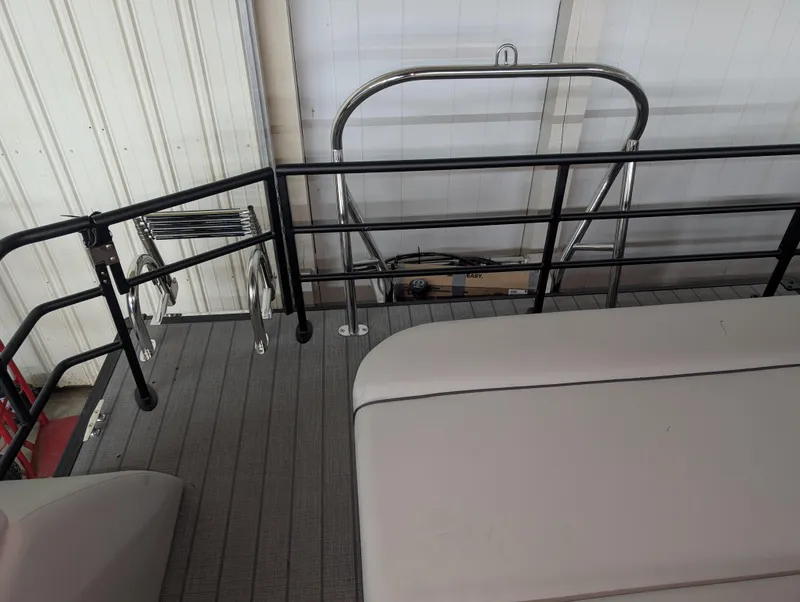 Slide: The Image of 2025 Sylvan Mirage 8522 CLZ boat deck with railing and seating. - 10