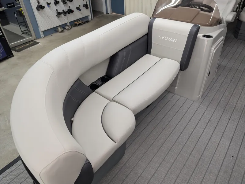 Slide: The Image of 2025 Sylvan Mirage 8522 CLZ boat interior with plush seating and modern design. - 3