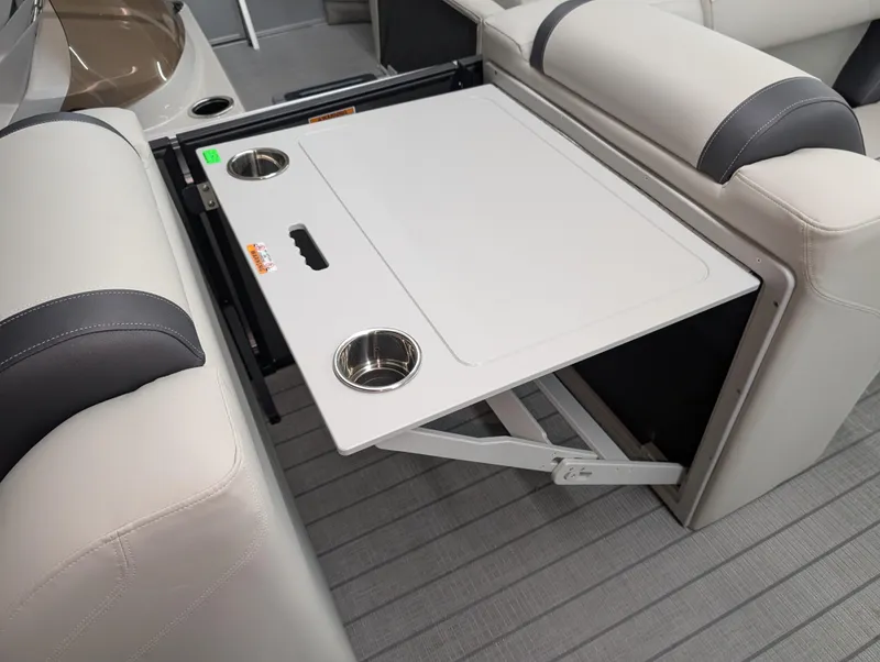 Slide: The Image of 2025 Sylvan Mirage 8522 CLZ interior with foldable table and cup holders. - 7