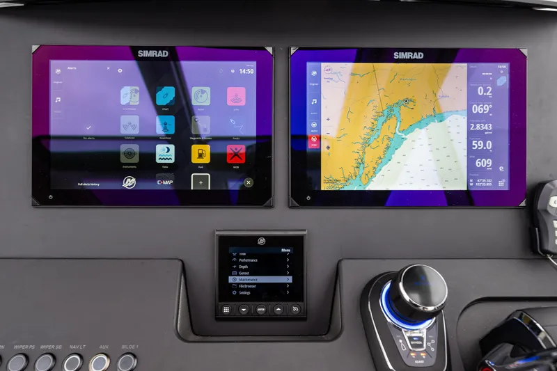 Slide: The Image of Dashboard of 2022 Nimbus C11 with dual Simrad navigation screens. - 16
