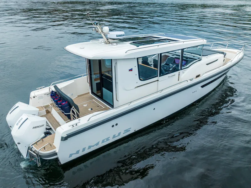 Slide: The Image of Nimbus C11 2022 boat on water, featuring sleek design and twin engines. - 38