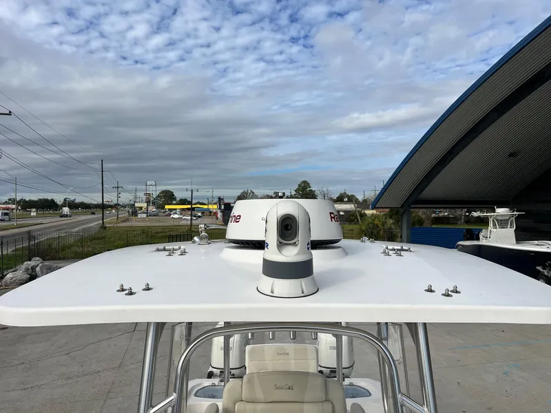 Slide: The Image of Sea Cat 260 boat roof with radar, 2019 model, under cloudy sky. - 15